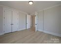 Bright bedroom features modern flooring, recessed lighting, and closet at 267 Luray Way # 445, Rock Hill, SC 29730