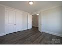 Bright bedroom with neutral walls, closet, and an open doorway at 275 Luray Way # 447, Rock Hill, SC 29730