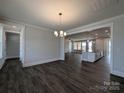 Spacious dining room with modern chandelier and an open floor plan at 275 Luray Way # 447, Rock Hill, SC 29730