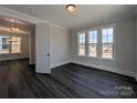 Light-filled bedroom with large windows and dark wood floors, offering a serene and stylish space at 279 Luray Way # 448, Rock Hill, SC 29730