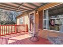 Inviting outdoor covered porch featuring a metal chair and view of surrounding landscape at 3080 Sims Rd, Rock Hill, SC 29730