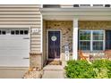 Inviting front porch with landscaped front yard at 317 Praline Way, Fort Mill, SC 29715