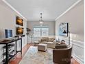 Bright living room with neutral walls, hardwood floors, a window, and a cozy seating area at 5136 Samoa Ridge Dr, Lancaster, SC 29720