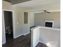 Open concept living room, with fireplace, half wall, and views into an adjacent bathroom at 649 Favorwood Dr, Rock Hill, SC 29730