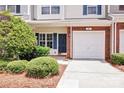 Charming townhouse featuring a front door, manicured landscaping, and an attached single-car garage at 804 Eddy Dr, Fort Mill, SC 29715