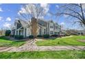 Beautifully landscaped townhouse with a well-manicured lawn and inviting curb appeal at 8250 Tradd Ct, Charlotte, NC 28210