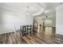 Elegant dining area featuring modern light fixture and hardwood flooring at 117 Cramerton Mills Pkwy, Cramerton, NC 28032