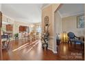 Elegant dining room featuring hardwood floors and a dazzling chandelier at 12502 Bending Branch Rd, Charlotte, NC 28227