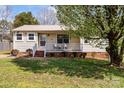 Cozy single-story home featuring a charming front porch and a well-kept lawn at 111 Cedar Dr, Salisbury, NC 28147