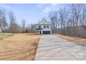 Attractive two-story home featuring a long driveway, two-car garage, and a well-maintained front yard at 113 Homewood Ln, Statesville, NC 28625