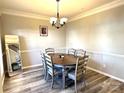 Dining room featuring a round dining table with six chairs and hardwood floors at 12217 Greymore Ct, Charlotte, NC 28277