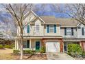 Exterior of the home features vinyl siding and an attached garage at 16729 Timber Crossing Rd, Charlotte, NC 28213