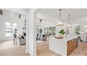 Bright living room featuring a fireplace, hardwood floors, high ceilings and natural light, perfect for relaxing and entertaining at 4069 Rivendell Rd # 5, Denver, NC 28037