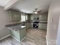 Updated kitchen with granite countertops and stainless steel appliances at 4904 Cornelia Dr, Charlotte, NC 28269