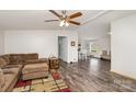 Open-concept living area flows into dining space, featuring stylish flooring and neutral tones at 6106 Ashley Dr, Concord, NC 28025