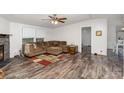 Living room features stylish flooring and a comfy, oversized sofa with an ottoman at 6106 Ashley Dr, Concord, NC 28025