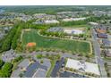 Aerial view of community fields, landscaping and surrounding neighborhood at 113 Burlingame Ct # C, Mooresville, NC 28117
