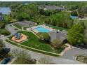 Community pool area with playground, lounge chairs, and meticulous landscaping at 113 Burlingame Ct # C, Mooresville, NC 28117