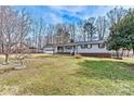 Charming single-story home with an attached garage and a well-maintained lawn at 1140 Knollwood Dr, Claremont, NC 28610