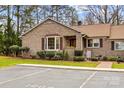 Beautiful brick home with mature landscaping and a dedicated parking space at 1202 Ravenwood Ct, Salisbury, NC 28147