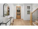 Bright entryway featuring hardwood floors, a glass-paneled front door, and stylish decorative accents at 1465 Highcrest Way, Rock Hill, SC 29730