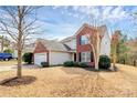 Exterior view of a two-story home showing garage and landscaping at 147 Amber Woods Dr, Tega Cay, SC 29708