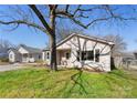 Charming single-story home with light siding, black shutters, and a green lawn at 1509 Harrill St, Charlotte, NC 28205