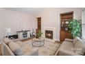 Cozy living room with a fireplace, built-in shelves, and neutral-toned furniture at 4108 Twenty Grand Dr, Indian Trail, NC 28079