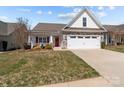 Charming single-Gathering home with stone accents, a red door, and an attached two-car garage at 420 Spring Arbor Ave # 80, Salisbury, NC 28146