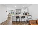 Bright kitchen with granite countertops, stainless steel appliances, and a breakfast bar at 4496 Springs Rd, Conover, NC 28613