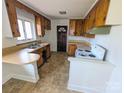 Functional kitchen design featuring wooden cabinetry, countertops, and a vintage white oven at 4801 Kipling Dr, Charlotte, NC 28212