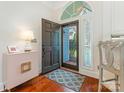 Welcoming entryway featuring hardwood floors, an open door, and stylish decor at 800 Water Wheel Ct, Charlotte, NC 28209