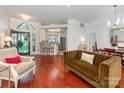 Bright living room with hardwood floors and an open floor plan with easy access to the kitchen at 800 Water Wheel Ct, Charlotte, NC 28209