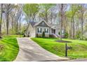 Inviting home with attached garage, long driveway, and well-maintained lawn at 1823 Rain Forest Dr, York, SC 29745