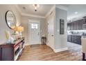 Welcoming foyer with hardwood floors, console table, and view into the kitchen at 1823 Rain Forest Dr, York, SC 29745