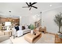 Bright and airy living room with hardwood floors and open layout to the kitchen at 2969 Beech Nut Rd, Charlotte, NC 28208