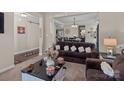 Comfortable living room showcasing open layout to the dining room with elegant decor at 3181 Helmsley Ct, Concord, NC 28027