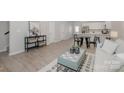 Spacious living room with hardwood floors offering seamless flow to the kitchen and dining areas at 336 A Lincoln St, Concord, NC 28025