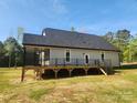 Expansive backyard featuring a large wooden deck perfect for outdoor entertaining and relaxation at 409 Henry Chapel Rd, Belmont, NC 28012