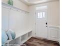Welcoming entryway with built-in bench, coat hooks, and bright, natural light at 4211 Black Ct # 193, Harrisburg, NC 28075