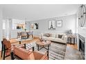 Comfortable living space features hardwood floors, a fireplace, a view into the kitchen and lots of light at 7707 Petrea Ln, Charlotte, NC 28227