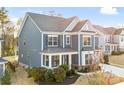 Beautiful two-story home with landscaped yard, covered porch, and classic architectural details at 967 Stebbins Dr, Fort Mill, SC 29715