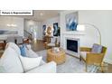 Bright open concept living room with modern decor and a cozy fireplace, adjacent to dining area at 1055 Merganser Way, Indian Trail, NC 28079