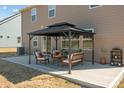 Relaxing backyard patio featuring an outdoor seating area under a gazebo perfect for outdoor entertaining and lounging at 141 Slip Shot Ln, Troutman, NC 28166