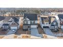 An aerial view of a modern home showcasing its location within a residential neighborhood and proximity to nearby amenities at 16200 Winfield Hall Dr, Charlotte, NC 28273