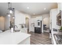 Spacious kitchen boasting white cabinetry, an island, and stainless steel appliances at 16200 Winfield Hall Dr, Charlotte, NC 28273
