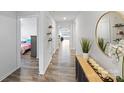 Bright hallway with hardwood flooring and modern decor leading to bedrooms and living spaces at 2766 Sherrills Stream Dr, Sherrills Ford, NC 28673