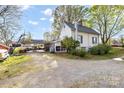 Spacious backyard features a covered area with ample room for parking and outdoor activities at 310 N Central Ave, Landis, NC 28088