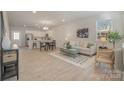 Open concept living space features a modern design, seamless integration of living and kitchen areas at 336 F Lincoln St, Concord, NC 28025