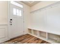 Bright foyer with hardwood floors, coat rack and storage, and natural light at 4217 Black Ct # 194, Harrisburg, NC 28075